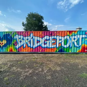 Colorful “Bridgeport” graffiti mural by Bio of Tats Cru, located at The Knowlton’s waterfront art park in Bridgeport, CT