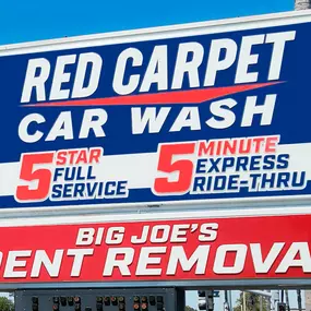 Prominent outdoor signage at Red Carpet Car Wash Manhattan Beach highlights its 5-Star Full Service, 5-Minute Express Ride-Thru, and exclusive Big Joe’s Dent Removal services.