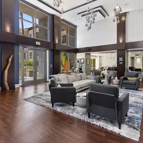 A modern living room with a large rug and a long couch.