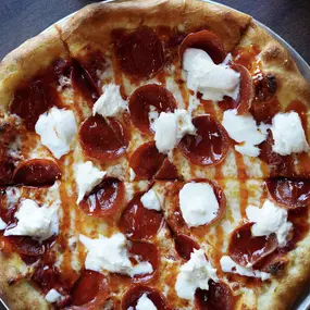 Signature Hot Honey Pepperoni Pizza from Water Street Grille in Yorktown, VA — a bold, sweet, and spicy favorite.
