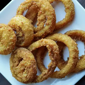 Hand-battered onion rings, fried to golden perfection at Water Street Grille in Yorktown, VA.