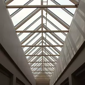 Long triangular pyramid skylight on a commercial roof by Schulte Roofing.