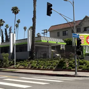 View of Speedwash Catalina located at 4000 Beverly Blvd, featuring a prominent green sign, promotional banners for unlimited express washes starting at $19.99, and entry access via Catalina Street. Ideal for local and drive-by visibility.