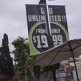Prominent promo signage communicating Speedwash’s unlimited monthly wash plan. Crisp and clear price messaging for walk-ins or drivers.