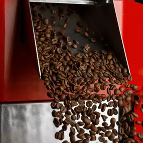 coffee beans falling from the roaster