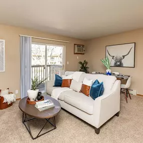 Spacious living room with sofa and dinning space