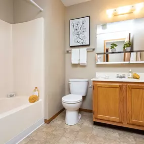 Bathroom with bathtub and mirror