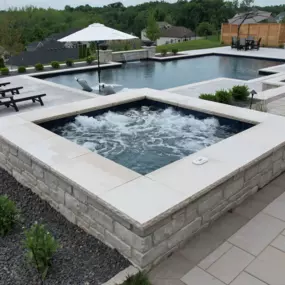 Custom spa with pool in background