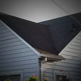 Fresh siding installation on a residential home, enhancing exterior protection with uniform panels.