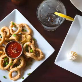 Calamari:
Flash fried, pan tossed with hot cherry peppers, garlic butter, scallions