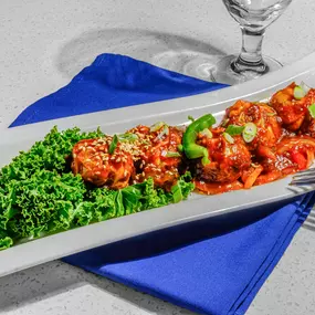 Steamed Chicken Momos filled with savory spices—an irresistible Indian street food favorite at Tabla Restaurant.