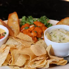 Bang bang shrimp, spinach artichoke dip, Cheesy Jalapeño sauce topped with pico & tortilla chips.