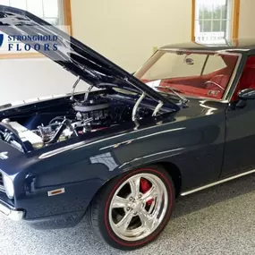 This epoxy garage floor was built to showcase a classic ride. Durable, dust-free, and flawless—ideal for those searching “garage epoxy flooring near me.”