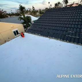 Flat roof installation by Alpine Exteriors.
