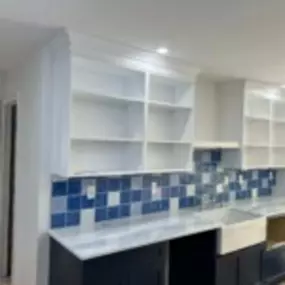 Add both functionality and visual appeal to your kitchen with a custom-designed island that serves as the centerpiece of the space. Ideal for food preparation, casual dining, and additional storage.