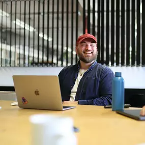 Chris smiling during a meeting at saintnicks Bristol office