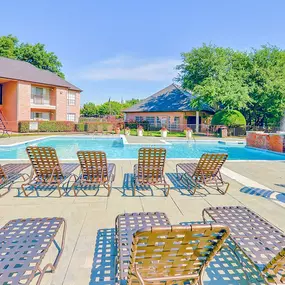 Resort-style pool surrounded by lounge chairs!