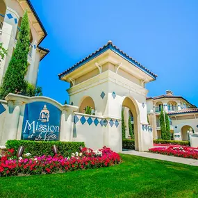 Community entrance with florals and luscious grass