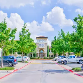 Spacious tree-lined parking lot for residents