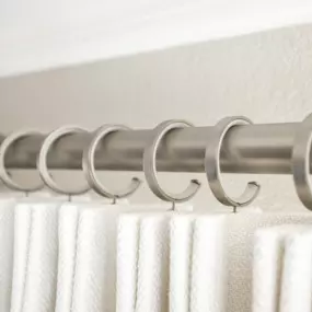 White drapery and nickel drapery hardware