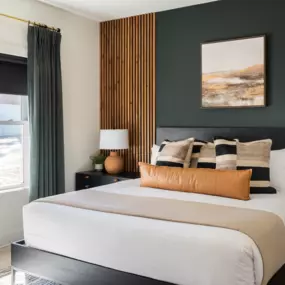 Roller shades layered with drapery to add depth to your room.