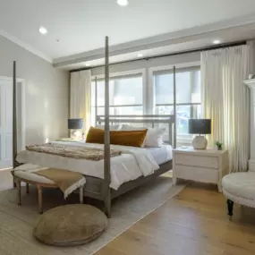 Transform your bedroom with motorized roller shades and drapery, offering ultimate convenience, privacy, security and energy efficiency. Rest easy in a comfortable and stylish space.