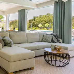 Add privacy and softness to your outdoor space with custom outdoor shades & drapes. Designed to withstand the elements while creating a cozy, elevated look for patios, decks, and pergolas.