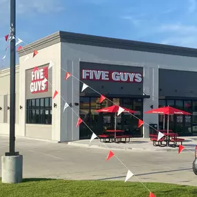Exterior photograph of the Five Guys restaurant at 625 West Highway 30 in Gonzales, Louisiana.