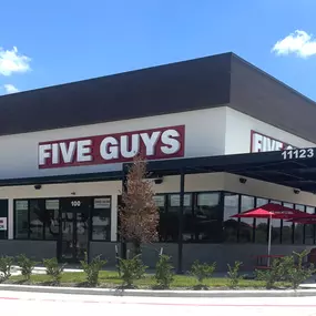 Exterior photograph of the Five Guys restaurant at 11123 West Airport Boulevard in Stafford, Texas.