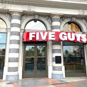 Exterior photograph of the Five Guys restaurant at 3377 South Las Vegas Boulevard in Las Vegas, Nevada.