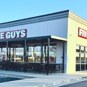 Exterior photograph of the Five Guys restaurant at 908 Buford Highway in Cumming, Georgia.