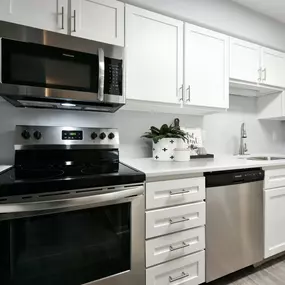 Kitchen with white cabinets and stainless steel appliances