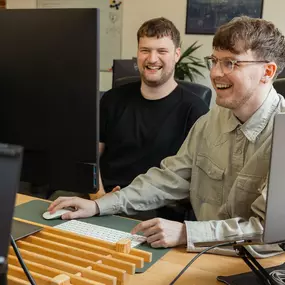 madeby.studio team members in front of a computer