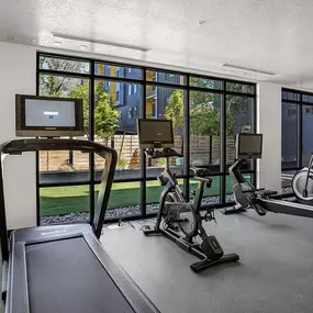 24 hour Fitness Facility with cardio machines and free weights.