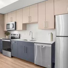 Open kitchen with ample storage space and energy star rating stainless steel appliances.