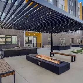 Outdoor fire pits with pavilion and seating.