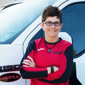 Employee next to work truck