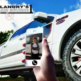 Employee next to work truck