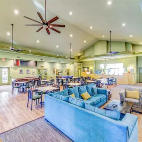 Spacious clubhouse with a couch and ample seating