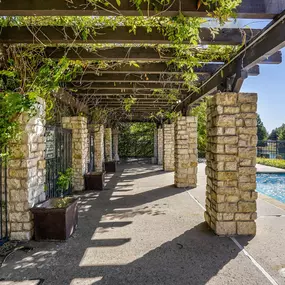 A shady pergola overlooking the pool