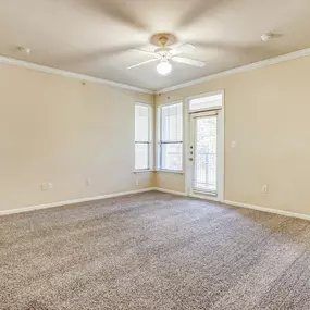 Interior of apartment with beige carpeting and light yellow walls