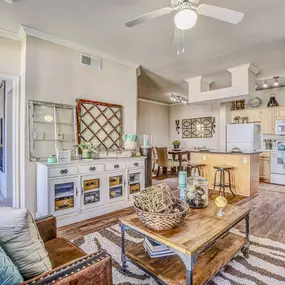 Beautiful living room with hard wood flooring, high ceilings, wooden coffee table and sofa