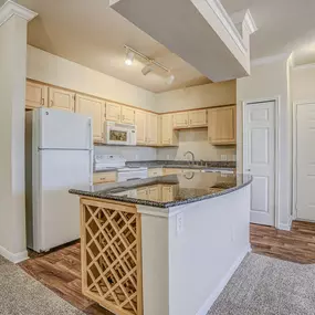 Bright and spacious kitchen with built in wine racks