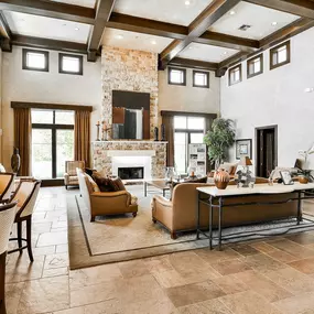 Interior of the leasing office with walls, wood flooring, and ample seating
