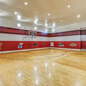 On site basketball gym with red walls