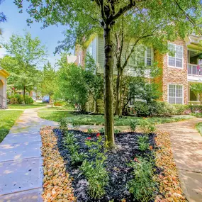 Exterior apartment walkway with trees