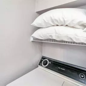 Laundry machine with overhead storage space