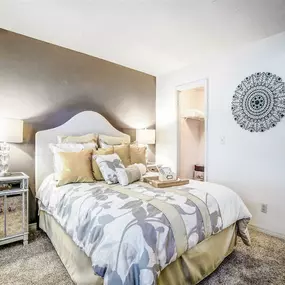 Bedroom with two lamps and accent wall