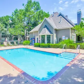 Pool view with clubhouse in the back