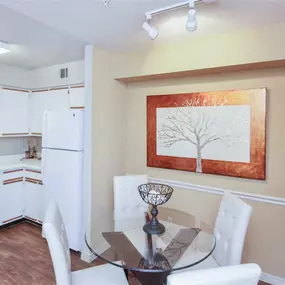 Kitchen view with glass dining table